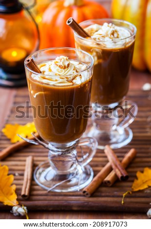 Pumpkin spice coffee with whipped cream and caramel
