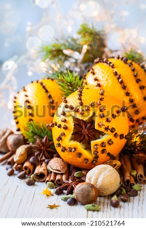 Oranges pierced with cloves,Christmas spices and nuts