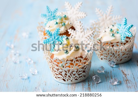 Festive Christmas cupcakes decorated with sugar snowflakes