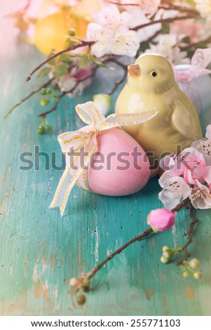 Easter decoration with spring flowers,chick and eggs in vintage style