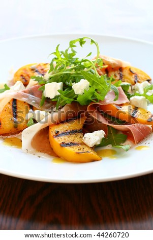 Rocket salad with grilled peach,parma ham and goat cheese