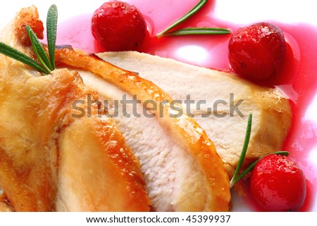 Sliced turkey breast with cranberry sauce and  rosemary