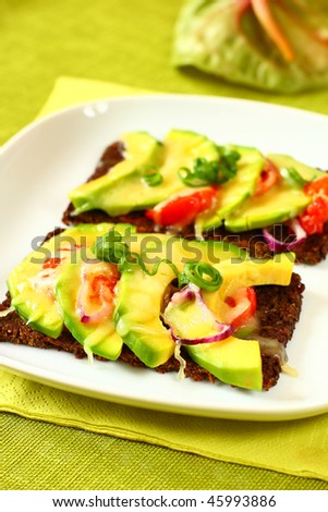 toast with avocado and tomato with cheese