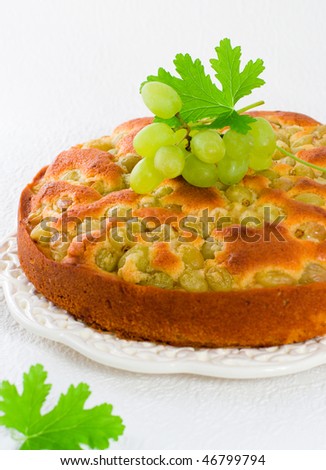 homemade biscuit cake with green grapes