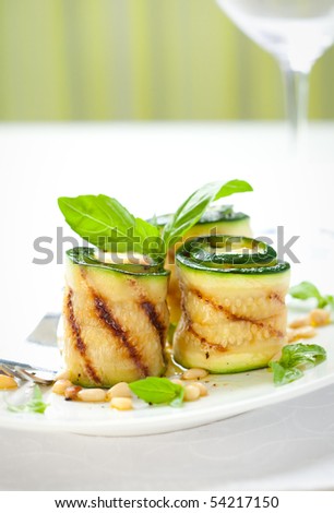 grilled zucchini roll with cheese ,basil and pine nut