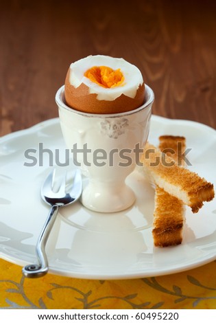 Boiled egg in an eggcup  and toast