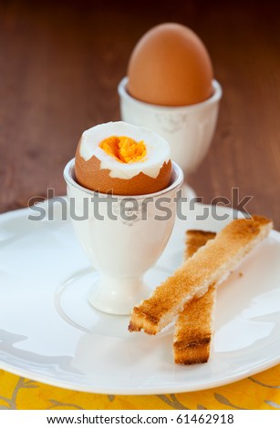 Boiled egg in an eggcup  and toast