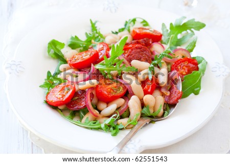 cannellini bean salad with roast cherry tomatoes,chorizo and red onion
