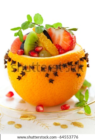 Fruit salad in  hollowed-out oranges studded with cloves   for Christmas