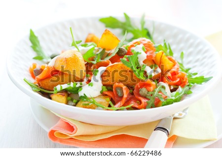 Potato salad with smoked salmon,capers,rocket and sauce