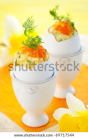 Eggs  stuffed with scrambled egg with chives and red caviar