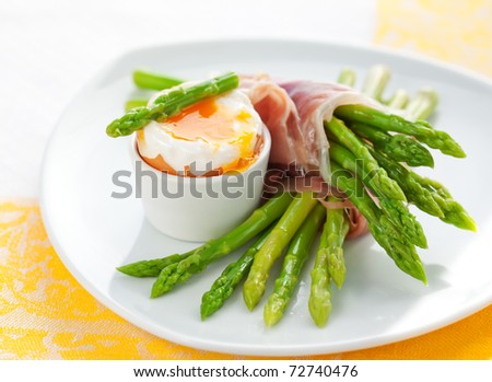green asparagus with soft-boiled egg and  ham