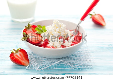 cottage cheese with strawberry sauce and fresh berries