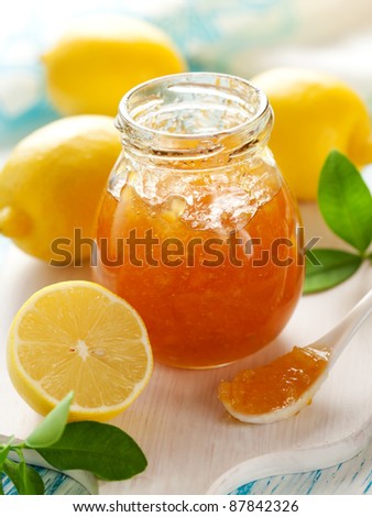Jar of Lemon Marmalade with Fresh Lemons