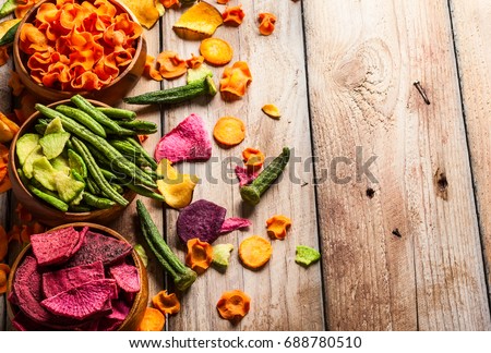 Dried vegetables chips from carrot, beet, parsnip and other vegetables . Organic diet and vegan food.