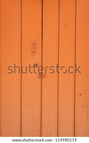 Orange door in small town
