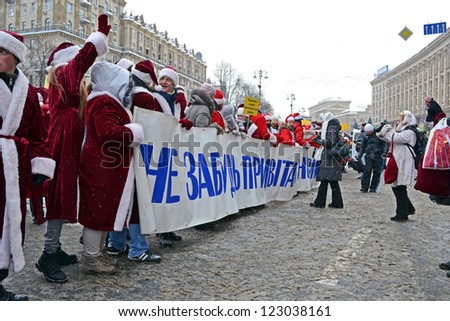 KIEV - DEC 22: Santa Claus (Did Moroz) greets people on December 22, 2012 in Kiev, Ukraine. Santa Claus Parade starts on Dec 22 on Kreshatik street in Kiev.