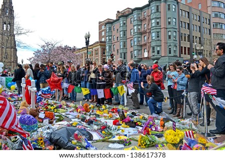 BOSTON - APR 20: People poured over the memorial set up on Boylston Street in Boston, USA on April 20, 2013. 3 people killed and over 100s injured during Boston Marathon bombing on April 15, 2013.