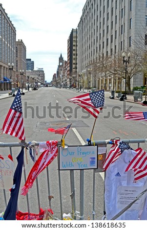 BOSTON - APR 20: American flags on Memorial set up on Boylston Street in Boston, USA on April 20, 2013. 3 people killed and over 100s injured during Boston Marathon bombing on April 15, 2013.