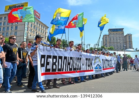 KIEV - MAY 18: Political meeting on May 18, 2013 in Kiev, Ukraine. People carry the flags with political slogans \