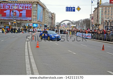 KIEV - MAR 08: Woman sport car rally show on Kreshatik in Kiev, Ukraine on March 08, 2013. Show organized by Kyiv City Autoclub and Automobile Federation of Ukraine.
