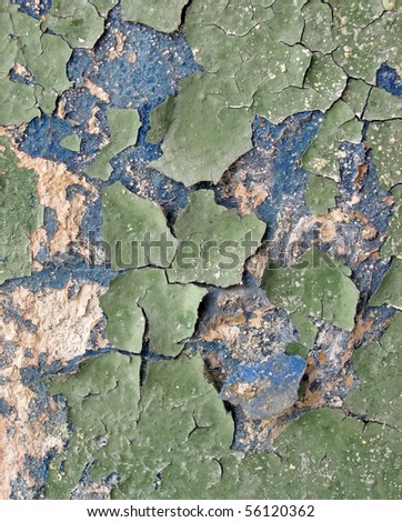 vintage diversity colorful painted cement wall with green color over blue paint. closeup texture background, old grungy construction, crisis concept