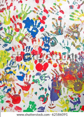 hand-print heap on concrete wall. chaotic rainbow hands heap (hand prints) diversity, abstract background, texture closeup