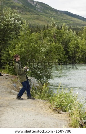 Fisherman pulling king salmon