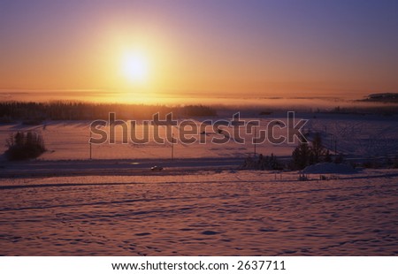Low winter sun over Fairbanks town and Tanana Valley in January at -35C. Fujichrome Velvia 50 slide , 6*9 size, old folder camera.