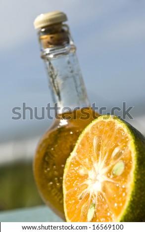 Orange drink bottle with a colorful orange.