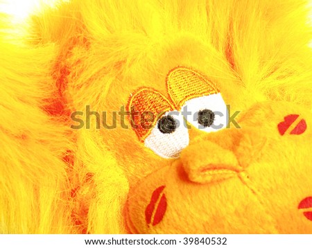 Crazy yellow monkey toy kissed
