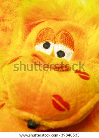 Crazy yellow monkey toy kissed