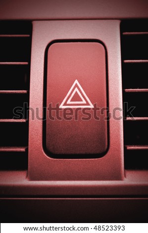Hazard warning push button. Red concept. This button can be found in any car.