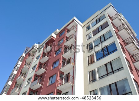 Apartment building.Multistoried modern and stylish living block of flats. Real estate. New house.Real Estate.