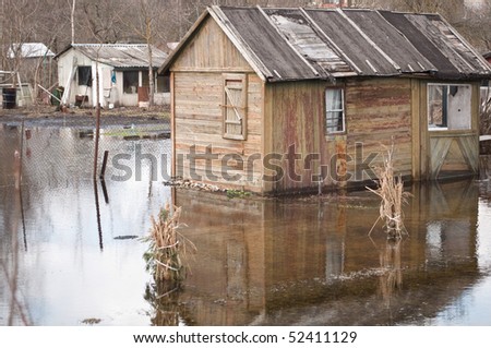 Floods in Latvia. House is floating in the water.