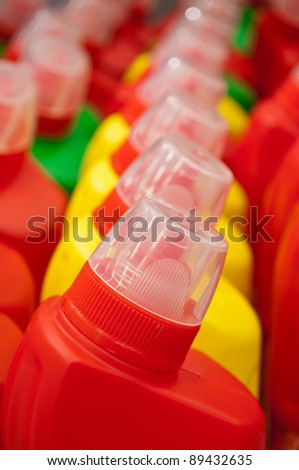 Row of sanitary bottles. Cleaning liquid detergent bottles. This kind of bottles are usually bought for WC or bathroom cleaning.