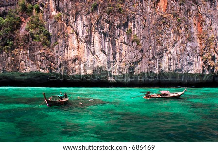longtail boats in turquoise waters, phi-phi island, phuket, thailand