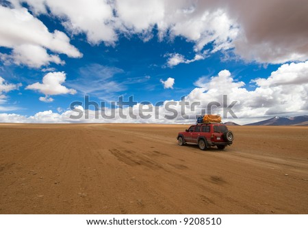 desert road, white clouds and deep blue sky