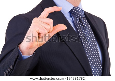 Businessman gesturing small size with fingers.