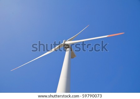 Wind turbine blade at blue sky.