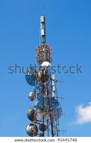Communication tower over a blue sky.