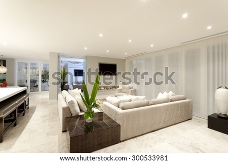 Spacious living room with gray sofas and beautiful lighting