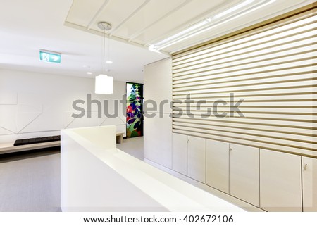 Reception room of a modern office or apartment with hanging lights on