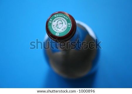 Top view of a wine bottle. Shallow DOF. Focus is on the generic cork label (no trademark shown).