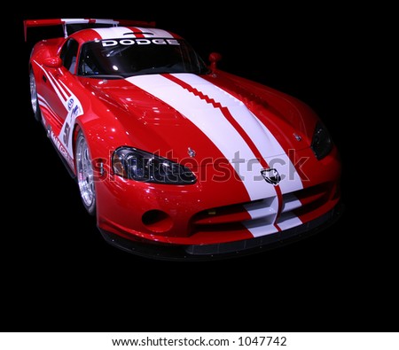 Isolated Dodge Viper on a black background. Focus on the front left lights.