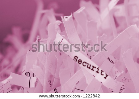 Shredded paper with text. Concept: Securing information