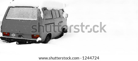 Black and white van with red rear lights in the snow. With copy space. CH symbol indicates the van is registered in switzerland. No logo shown.