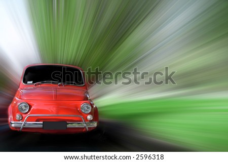 Small red generic car speeding in the country side.