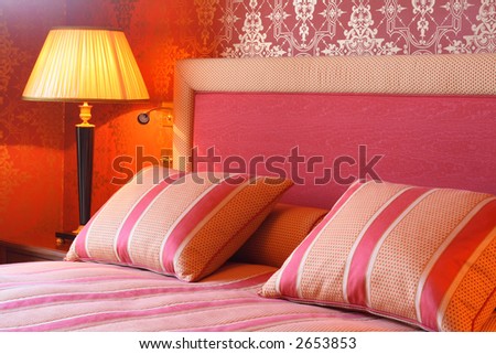 Regal bedroom with comfy pillows and duvet.