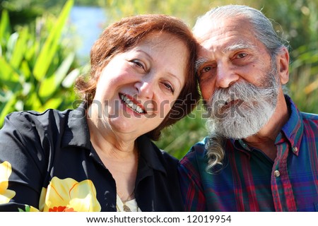 Old aged happy and loving couple living out retirement years.